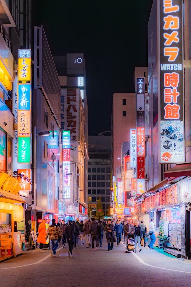 photograph of a city street at night.